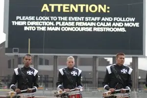 Crossmen percussionists warm up post rain delay.