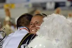 Phantom Regiment members embrace after winning the '08 World Championship title.